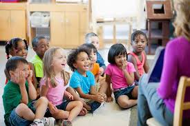 Preschool children sitting happily at storytime